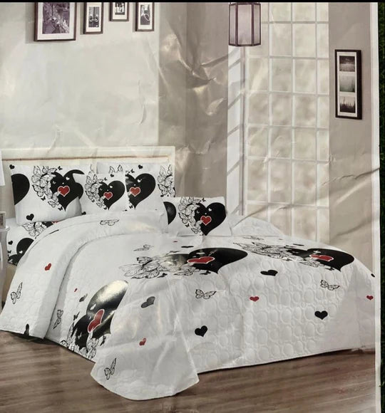 Bedding set with heart and butterfly patterns.