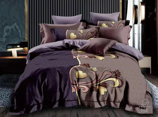 Bed with decorative bedding featuring floral patterns and heart designs.